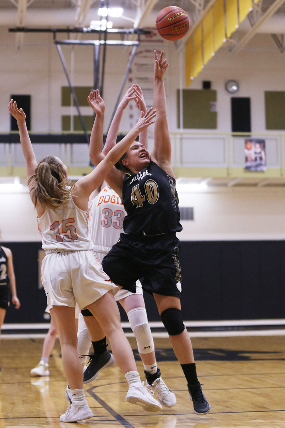 Danica Boyce jumps for two against Newcastle sophomore Hunter McFarland